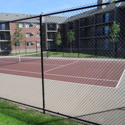 Brown tennis court for local complex