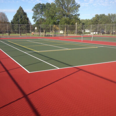 Red and Green thennis court with pickleball lines yellow