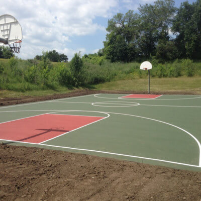 Full sized red and green basketball court