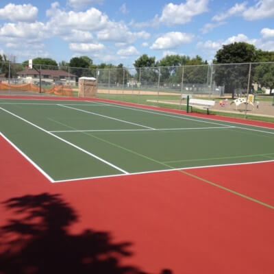 Red and green tennis court with pickleball lines